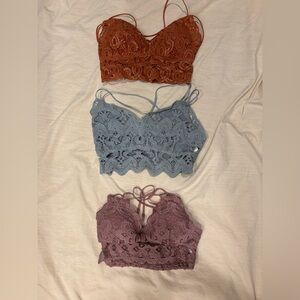 Three lace bralettes.